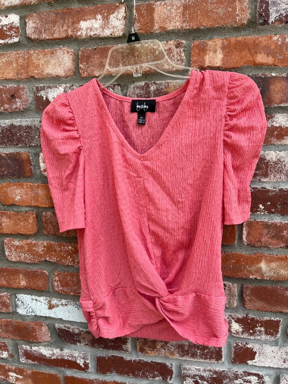 Coral colored blouse
